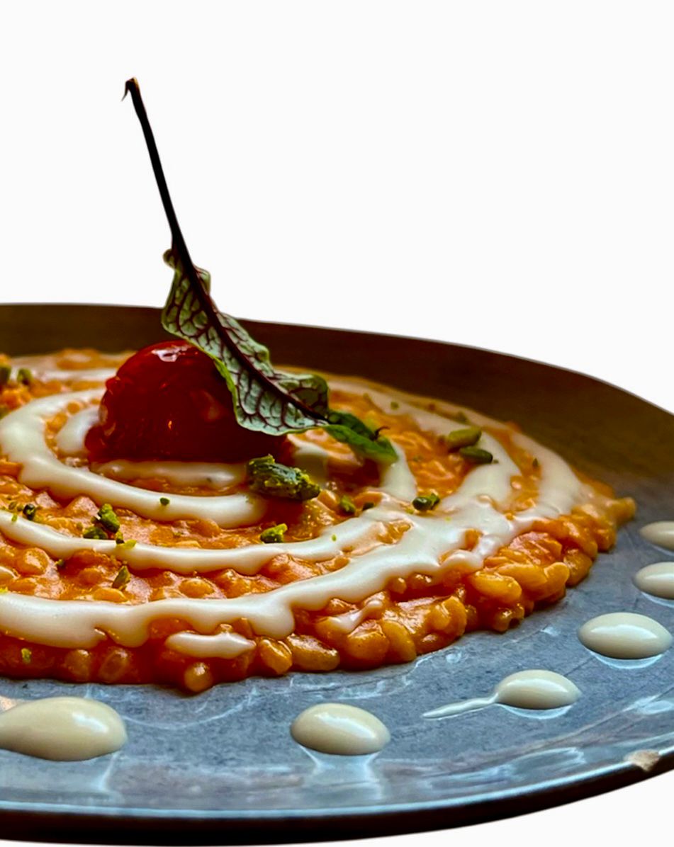 Risotto Carnaroli tostato con salsa di ciliegino al basilico e fonduta di provola